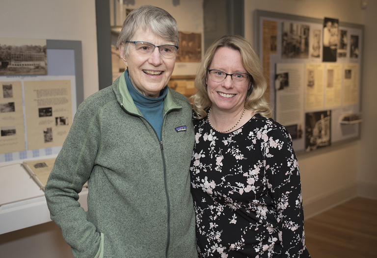 Two smiling women at the exhibit