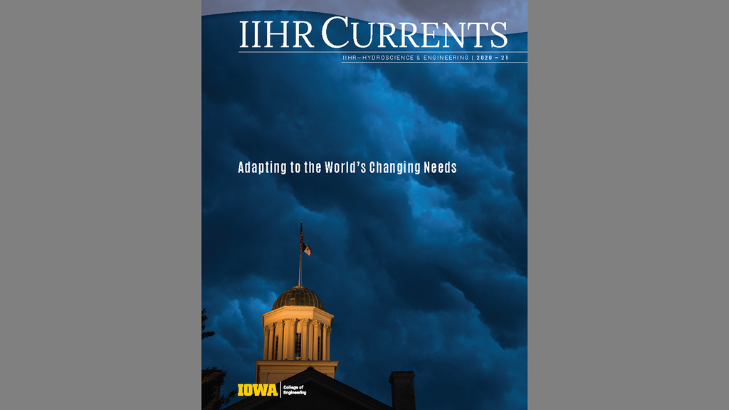 Cover of IIHR Currents featuring Old Capitol against a stormy sky